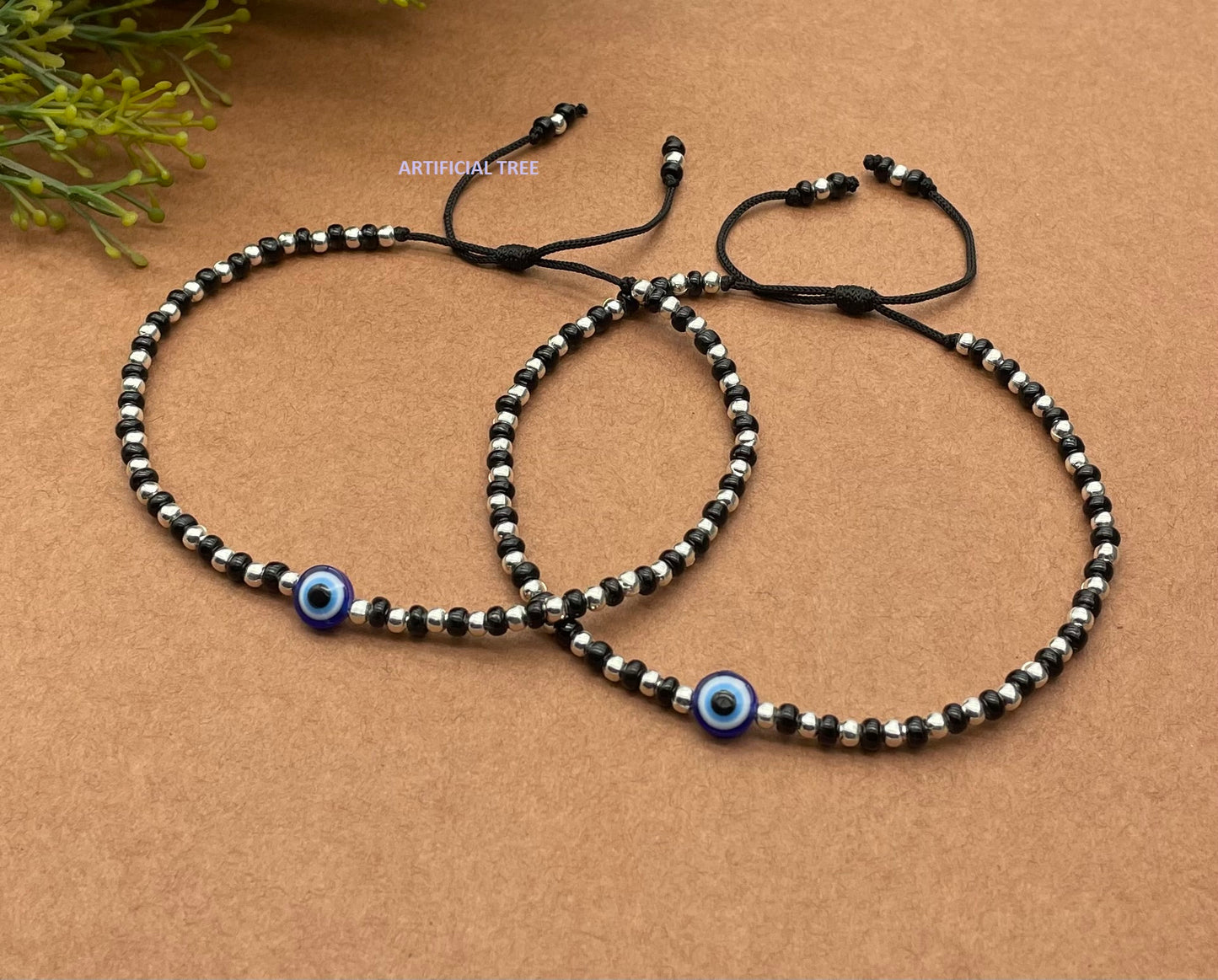 ARTIFICIAL JEWELS German Silver EVIL EYE Charms Black Thread Adjustable Nazariya Anklets | Nazar Battu | for Women and Girls (AT ANK 067)